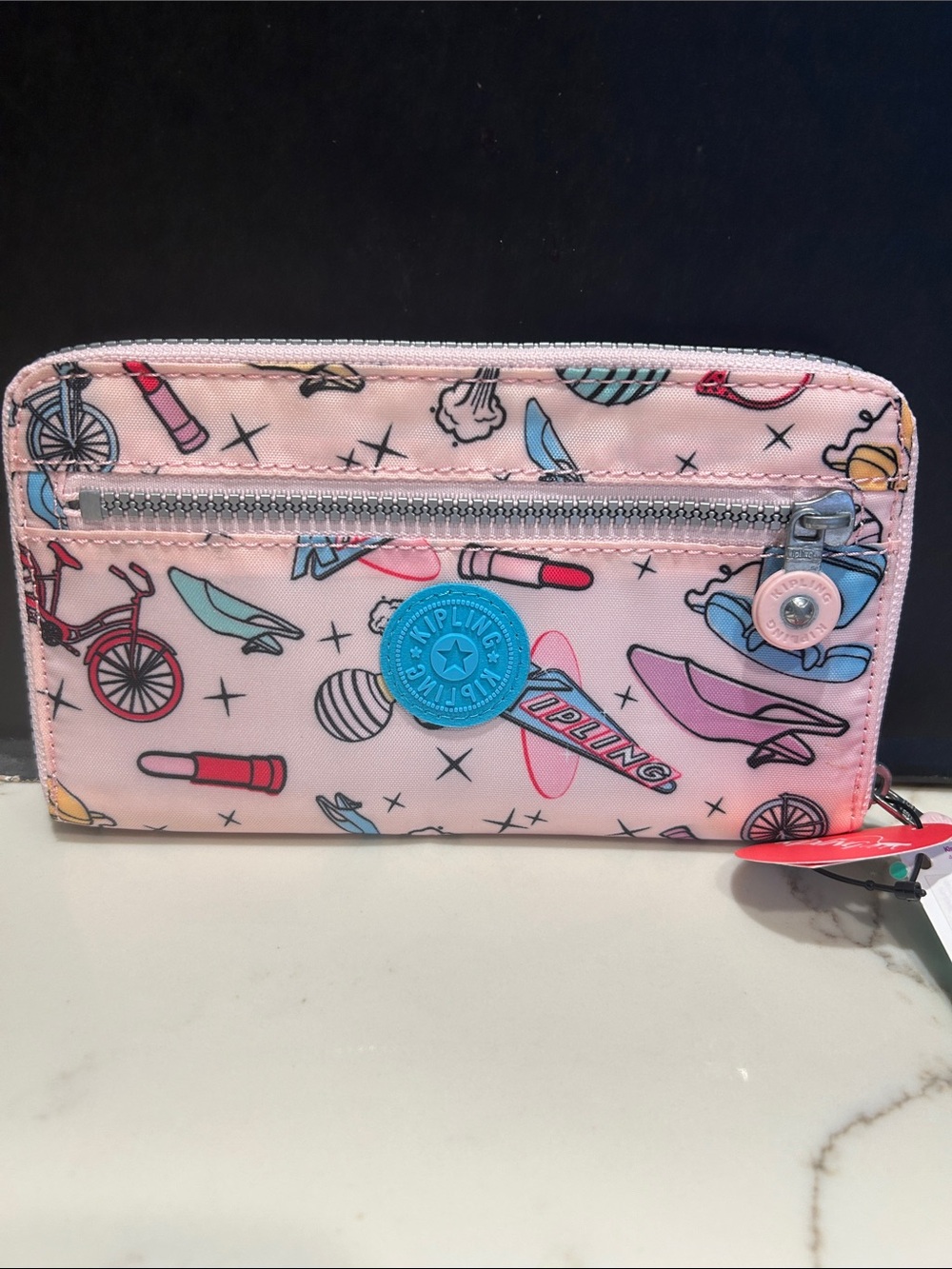 NWT Kipling Raffie Zip Around Wallet w/ Lipstick Bicycle Perfume Graphics
